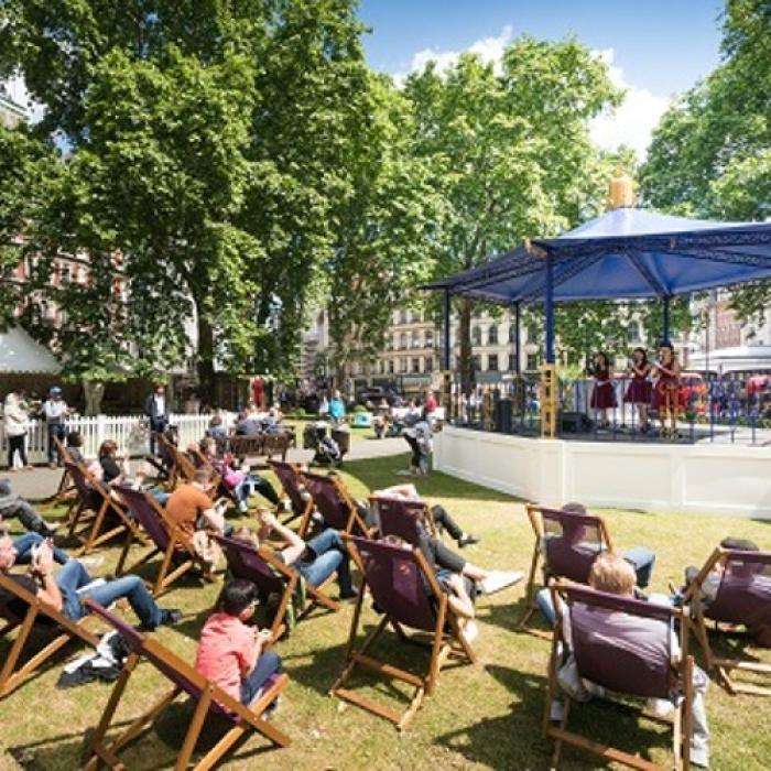 Outdoor party with deckchairs and music on a bandstand